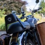 Rear view of the Royal Enfield Classic 350's seat backrest and leather panniers at the ford crossing