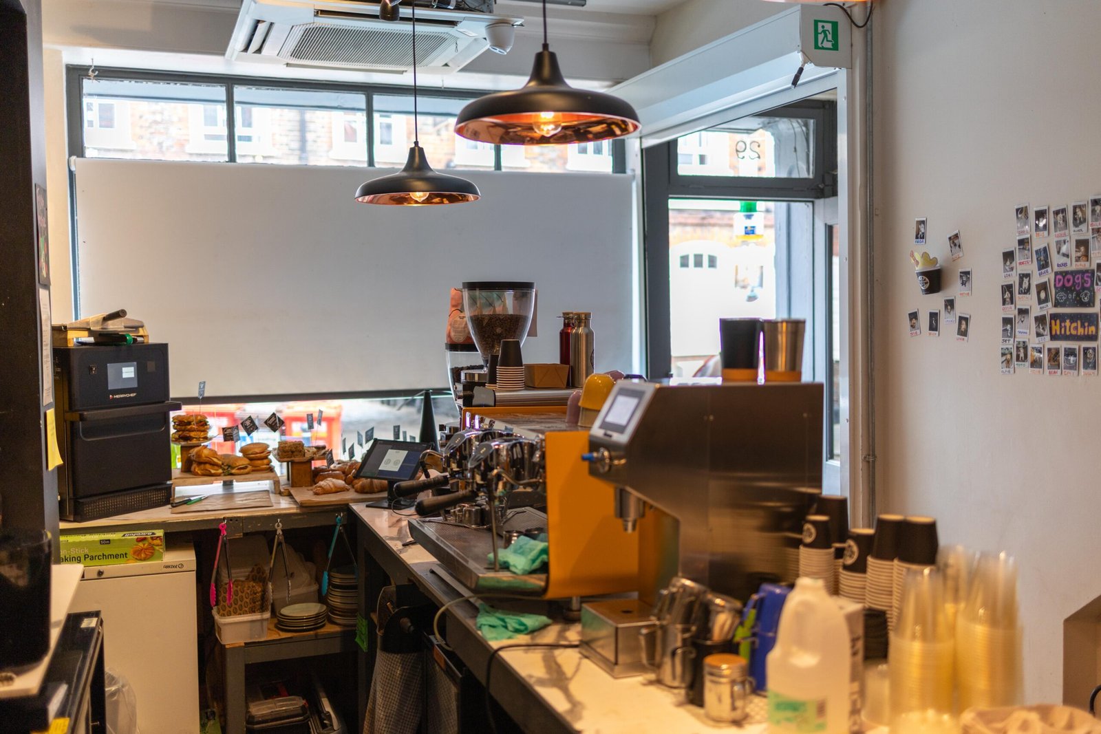 Espresso bar and back counter inside Coffee Lab, with the Dogs of Hitchin wall visible in the background
