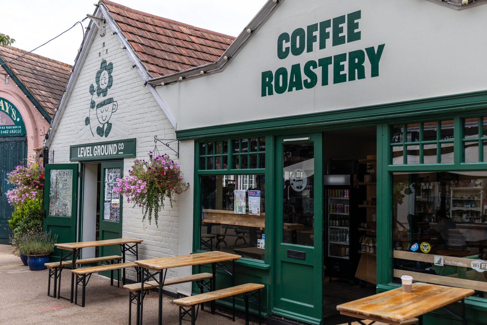 Level Ground Co coffee roastery shopfront and outdoor benches in Letchworth Garden City