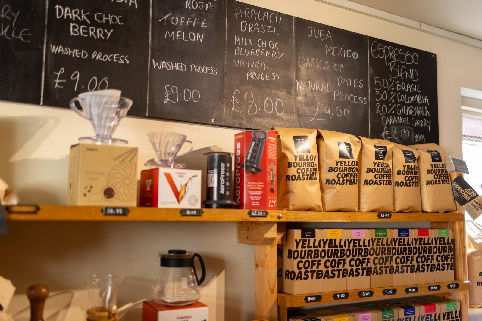 A chalkboard menu showing the Yellow Bourbon espresso blend breakdown, 50% Brasil, 30% Colombia, 20% Guatemala