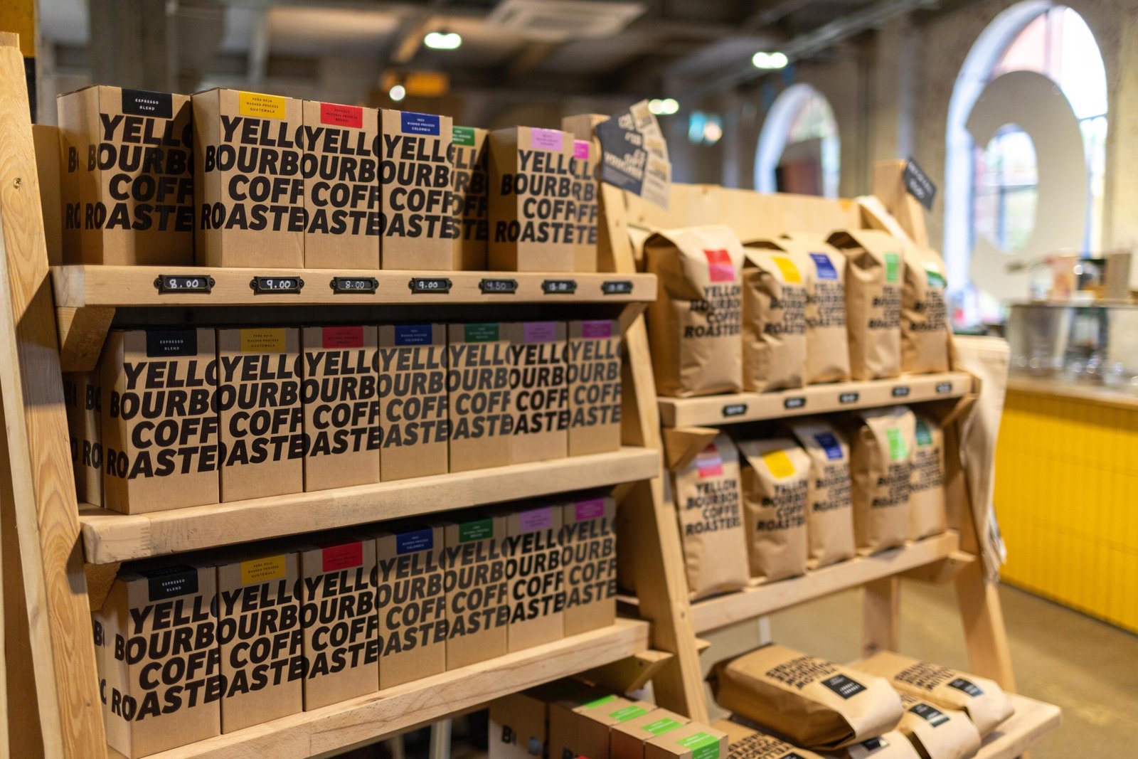 Retail shelves stocked with Yellow Bourbon coffee bags at the Weedon Depot