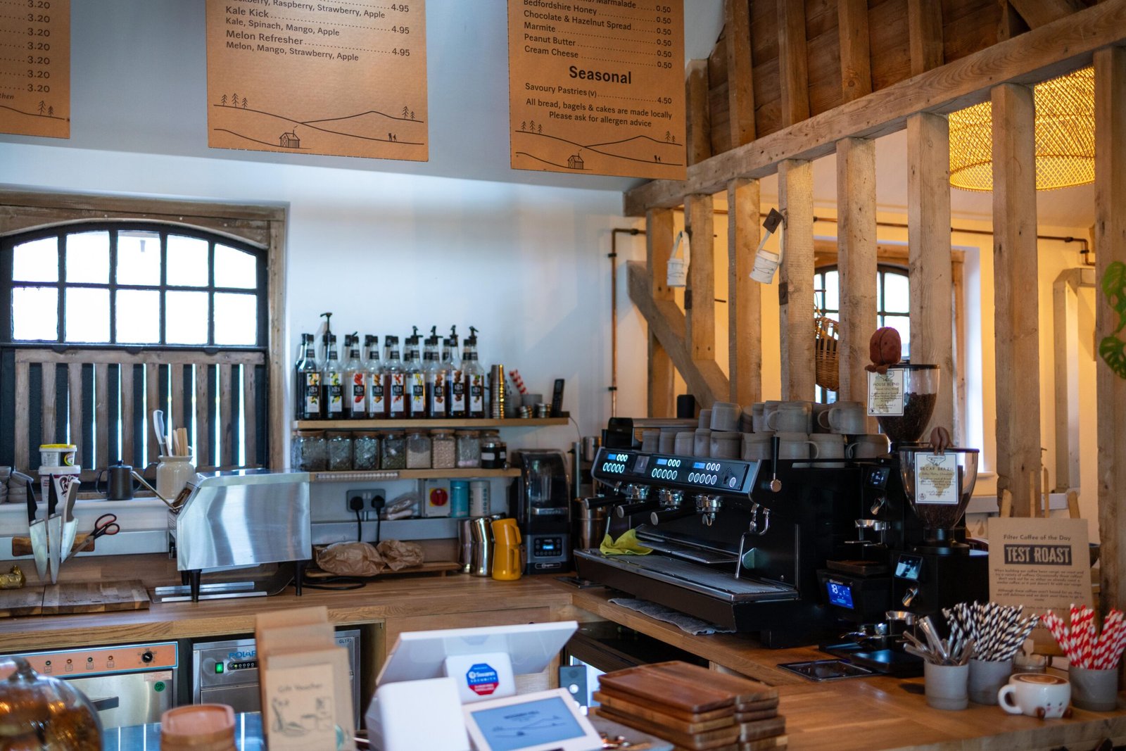 The espresso bar at Wooden Hill Haynes, with a Test Roast filter coffee sign on the counter