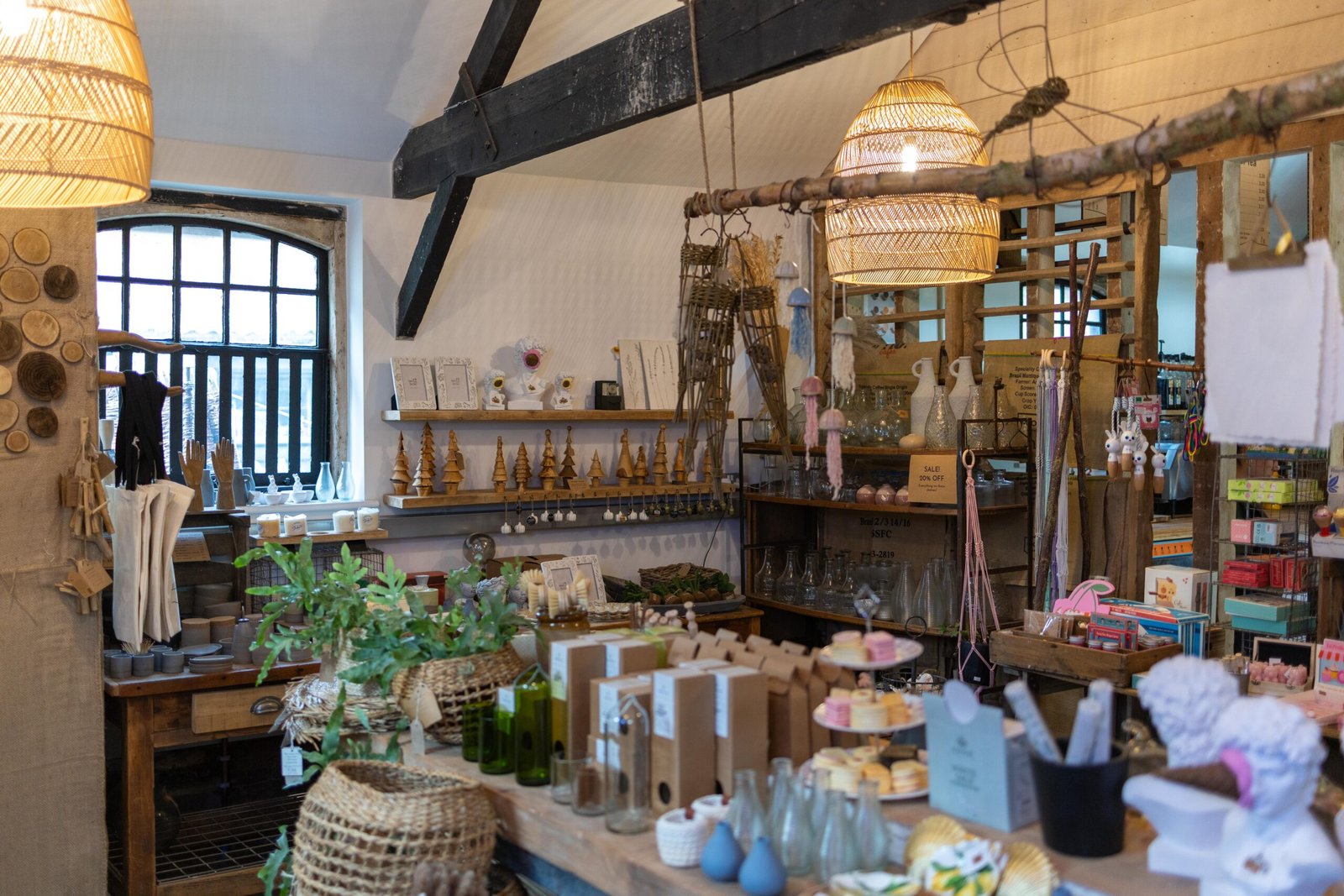 The homeware section of Wooden Hill's bigger shop at Haynes, with wicker pendant lights