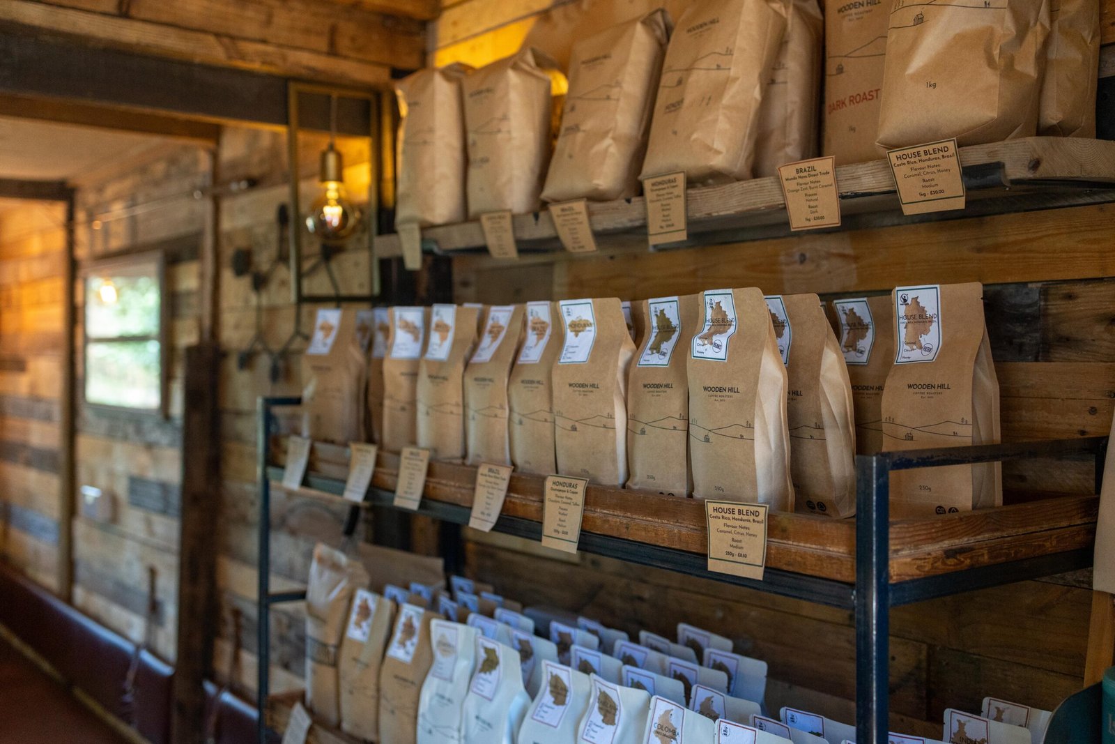 Retail shelves of Wooden Hill coffee bags on display at the Maulden cafe