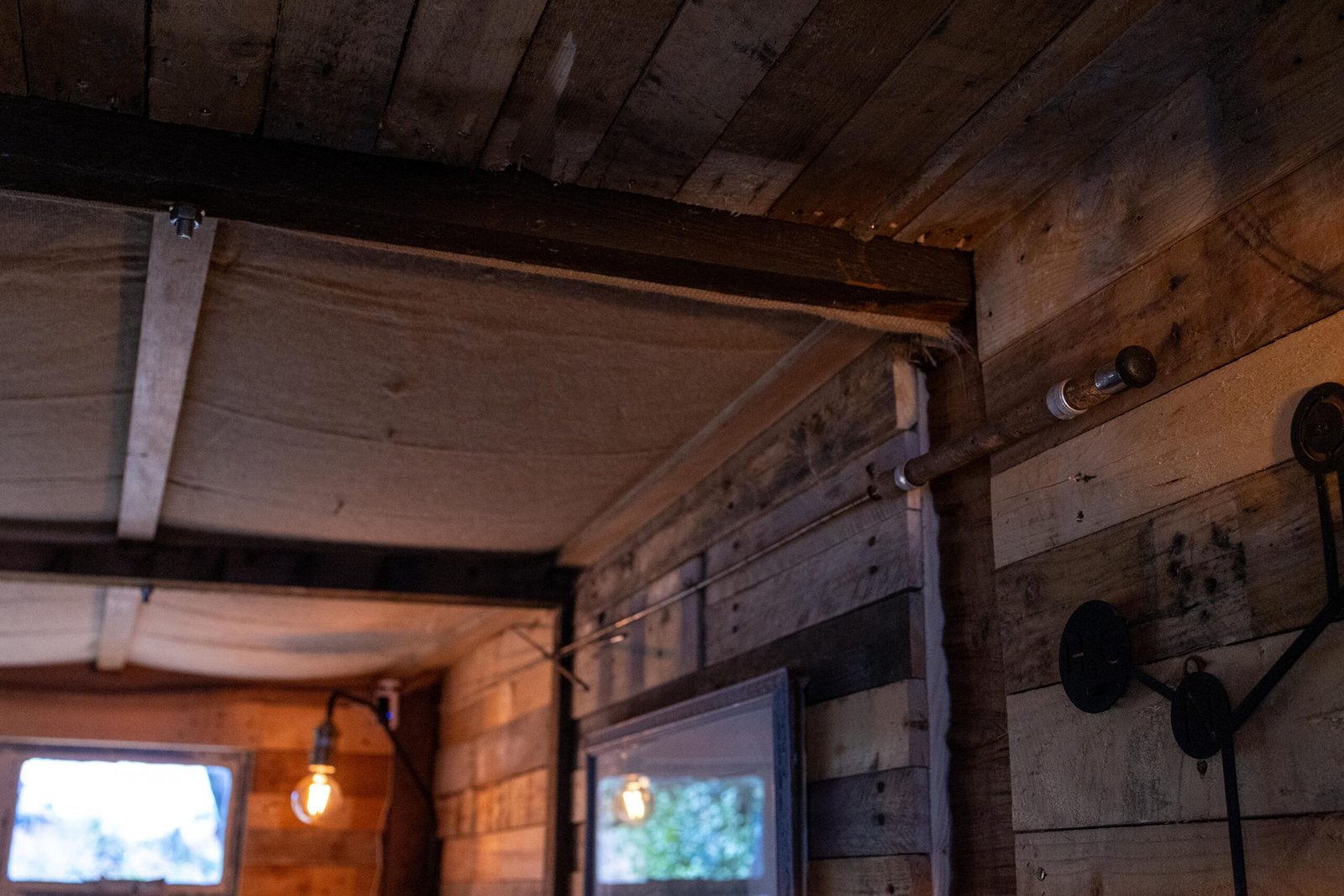Ceiling and roof detail at Wooden Hill's Maulden cafe, showing hessian insulation and salvaged windows