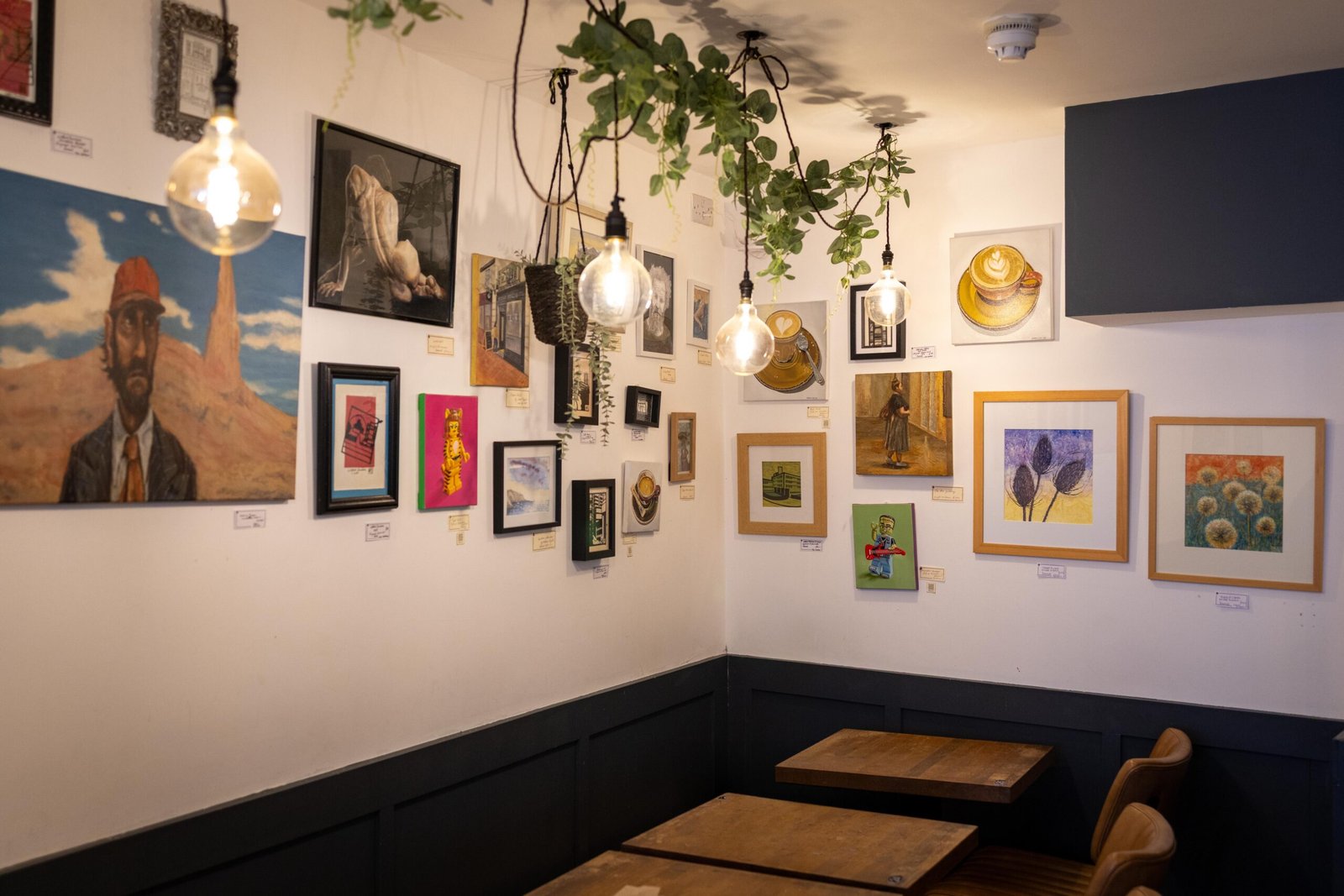 Artwork by local artists displayed across the walls