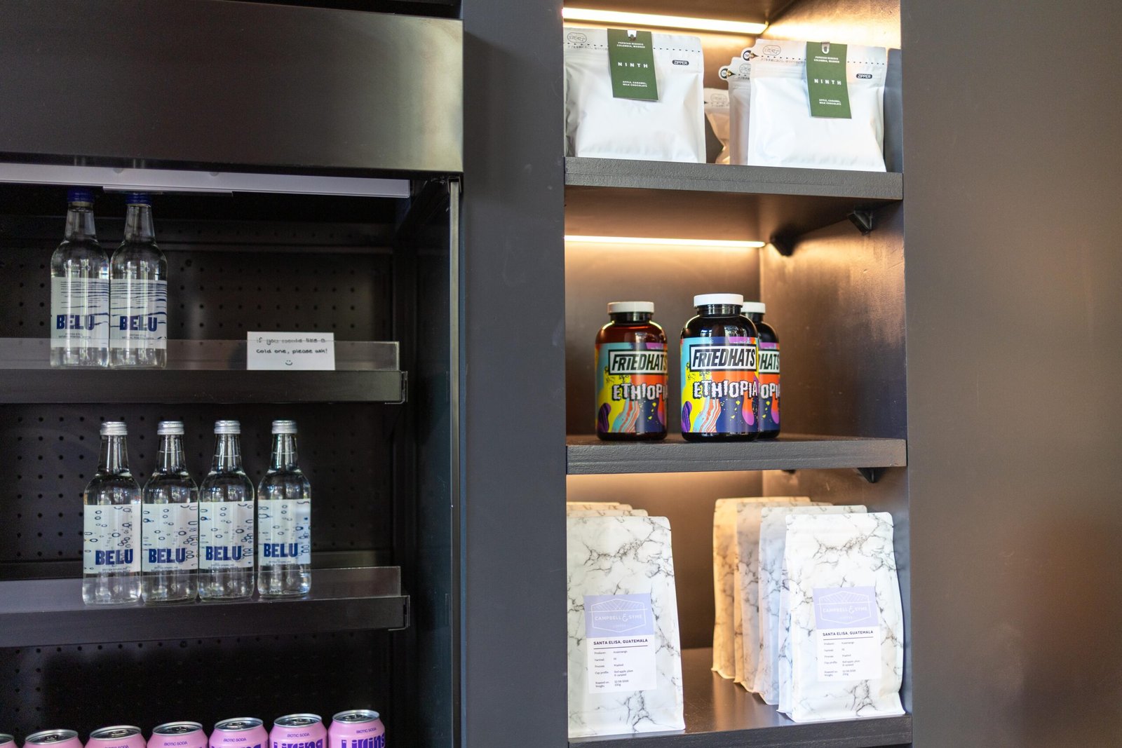 Retail shelf showing Ninth house-blend bags, Friedhats Ethiopia jars, and Campbell & Syme coffee bags