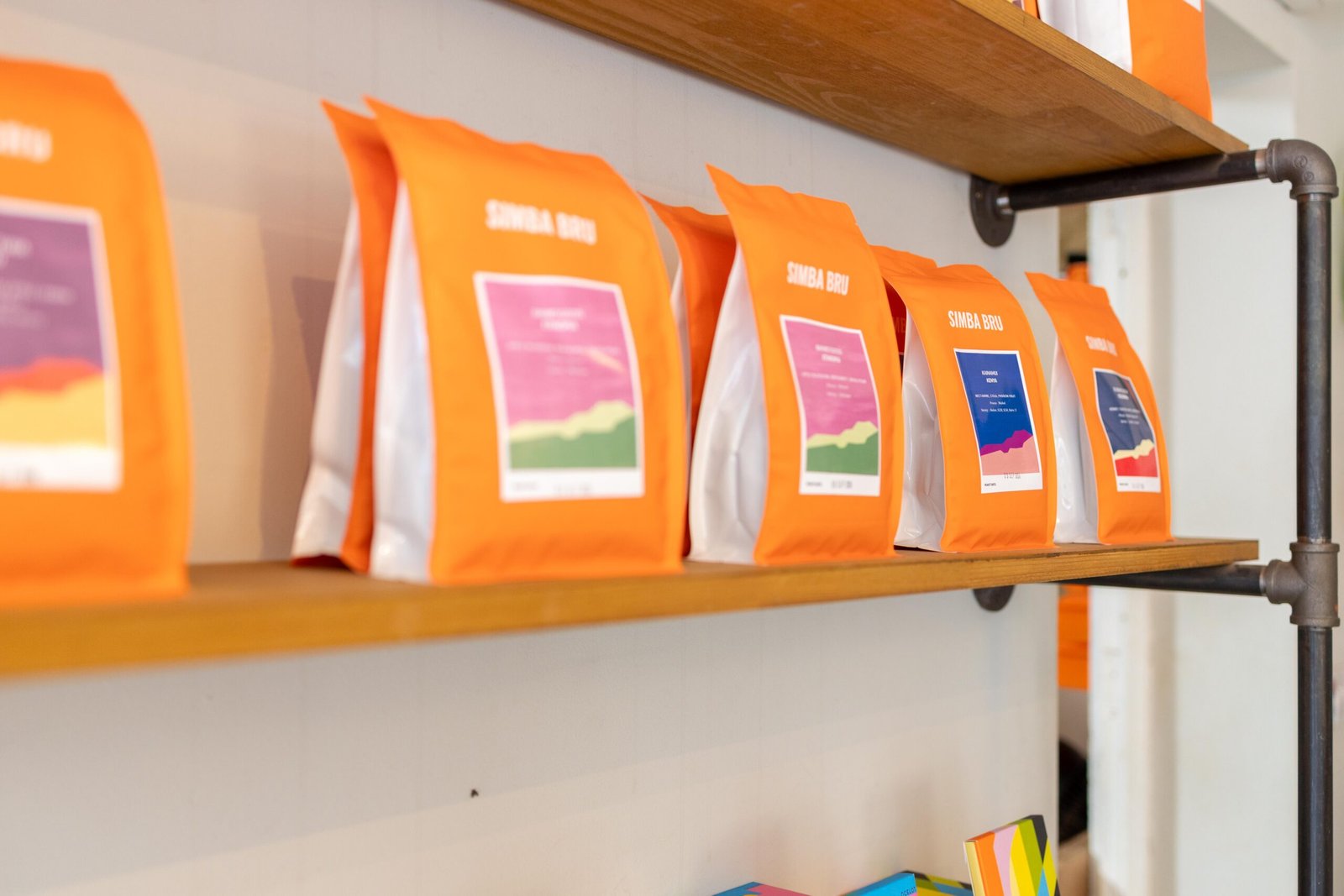 Bright orange bags of Simba Bru beans lining the shelves