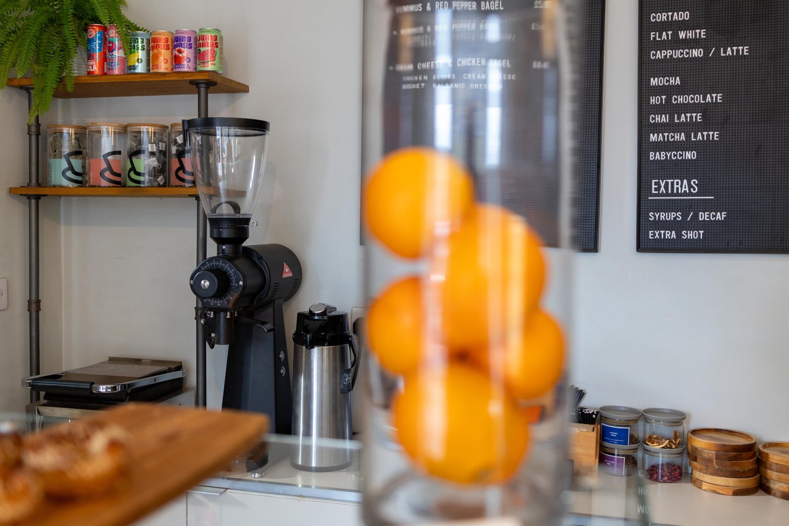 The back-lit artwork of London by Tannaz Oroumchi near the espresso machine
