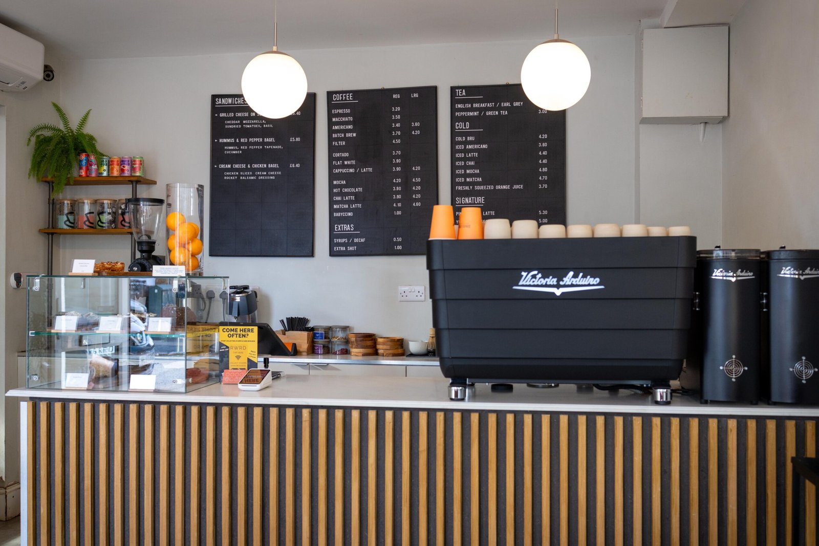 A column of fresh oranges beside the counter