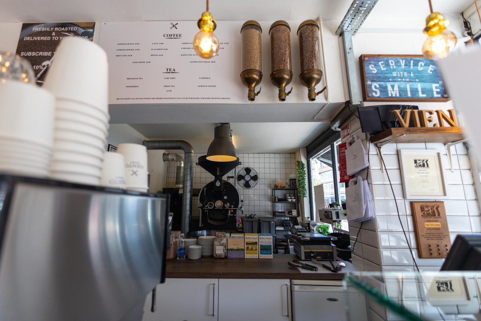 The substantial drum roaster housed behind the till