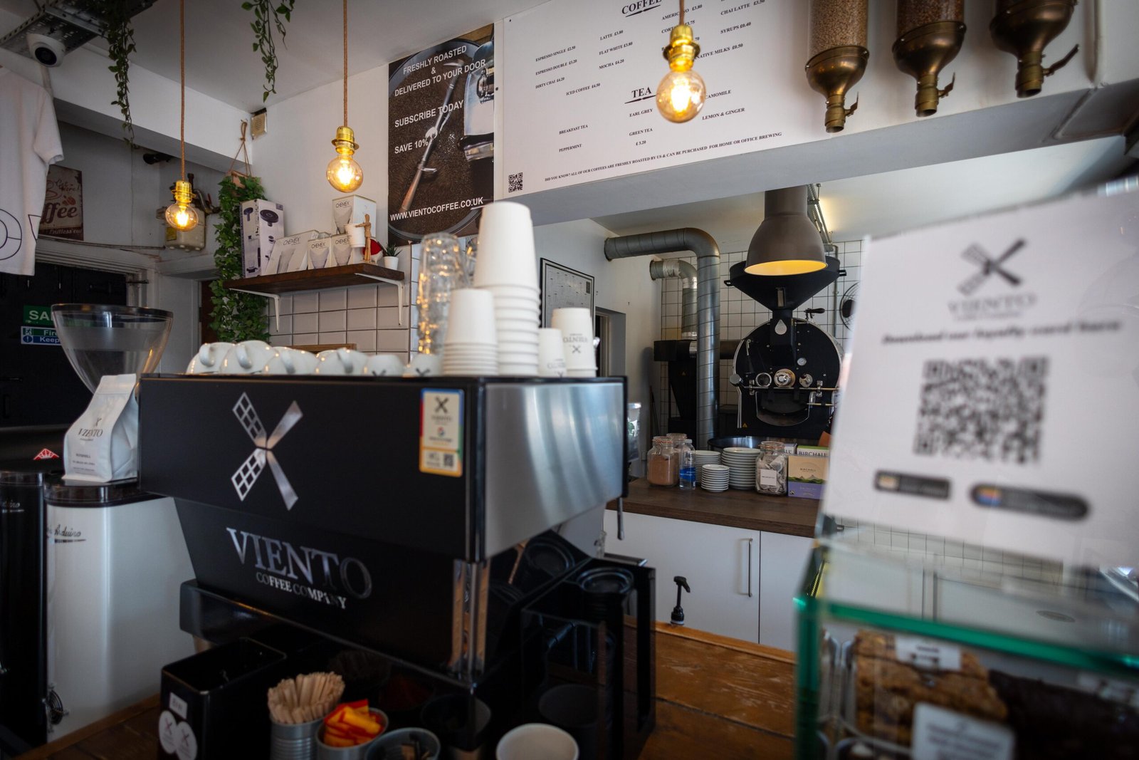 The framed photo tribute to founder Engin Gok roasting coffee