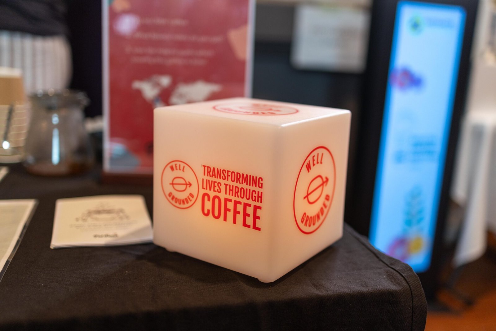 A Well Grounded branded cube reading Transforming Lives Through Coffee at Bristol Coffee Festival