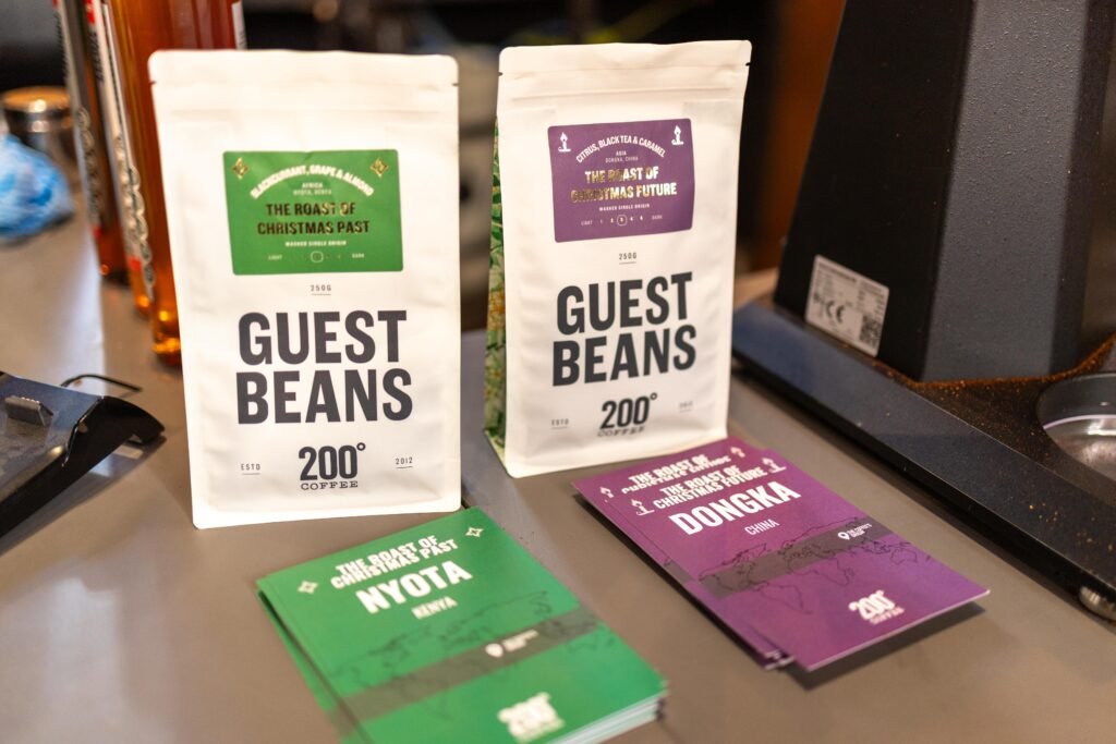 200 Degrees Guest Beans bags and Nyota and Dongka coffee cards on the counter at Nottingham Coffee Festival