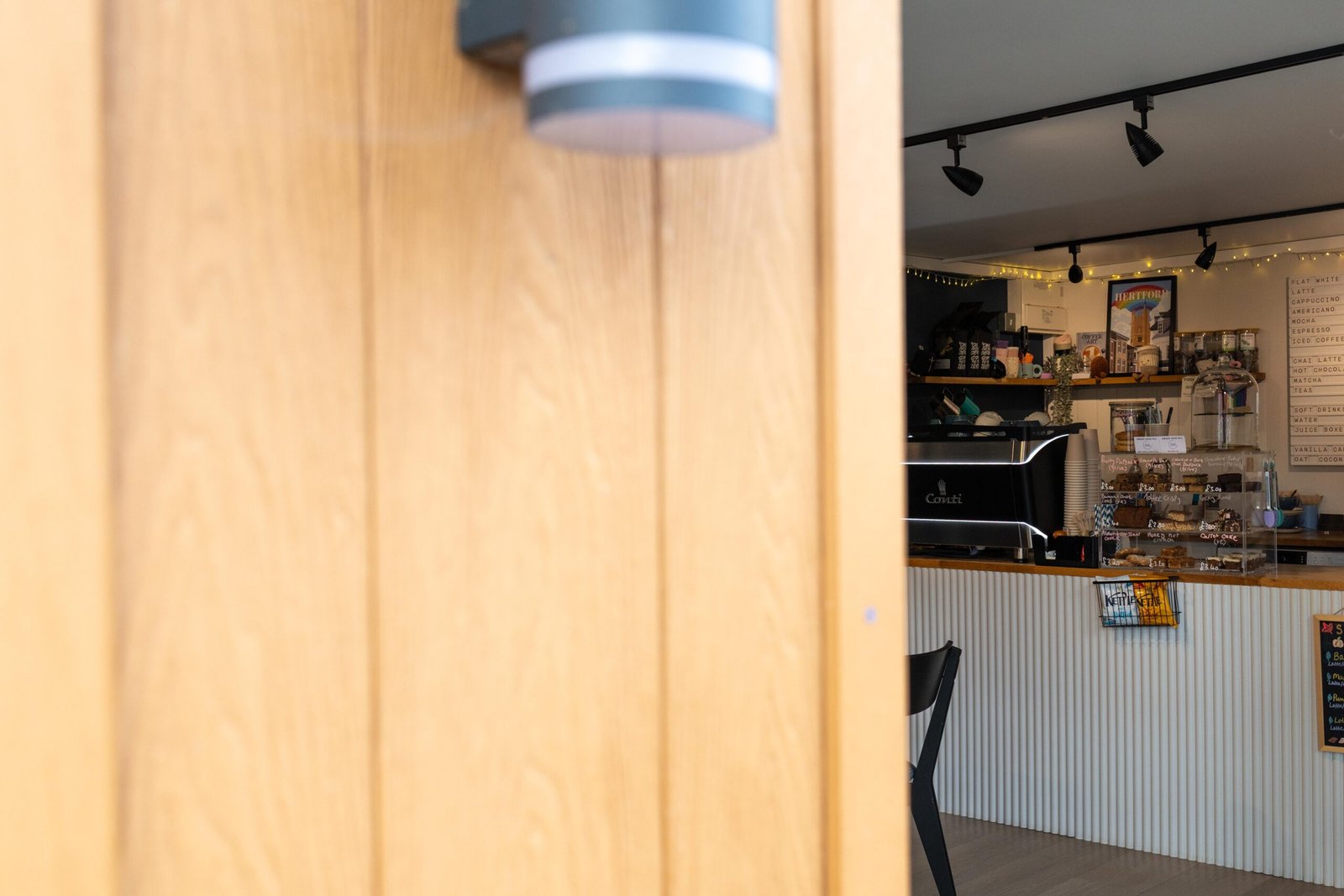 Wooden panelling beside the counter inside Bean & Gone Coffee
