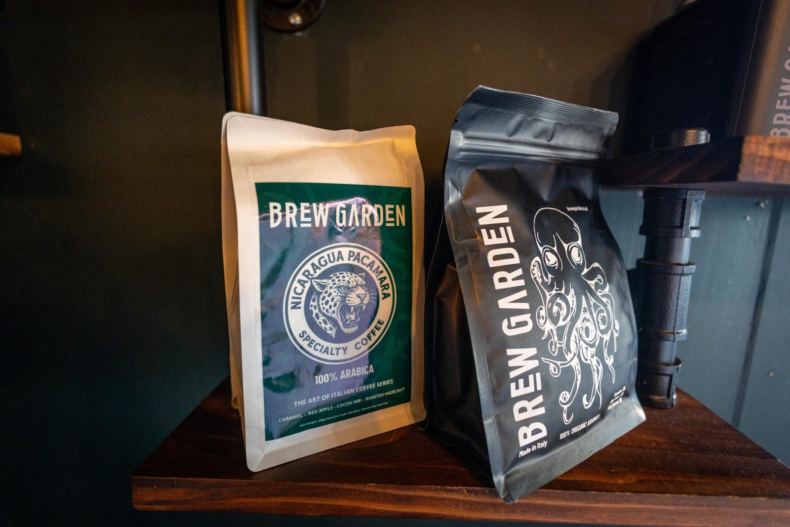 Two bags of Brew Garden coffee on a wooden shelf