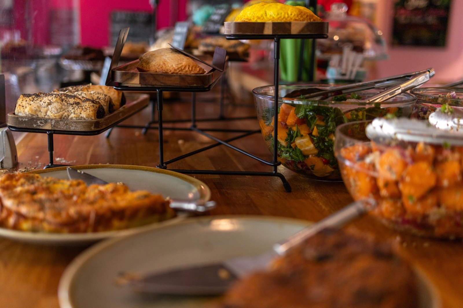 Homemade cakes and vegetarian dishes on the counter at Mudlarks Garden Cafe