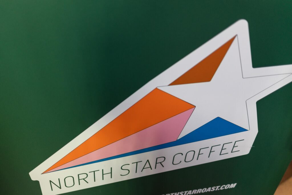 The North Star Coffee logo sticker on a green background
