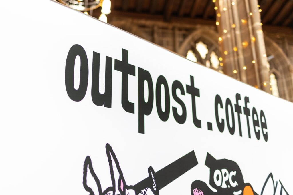 Large outpost.coffee sign inside St Mary's Church