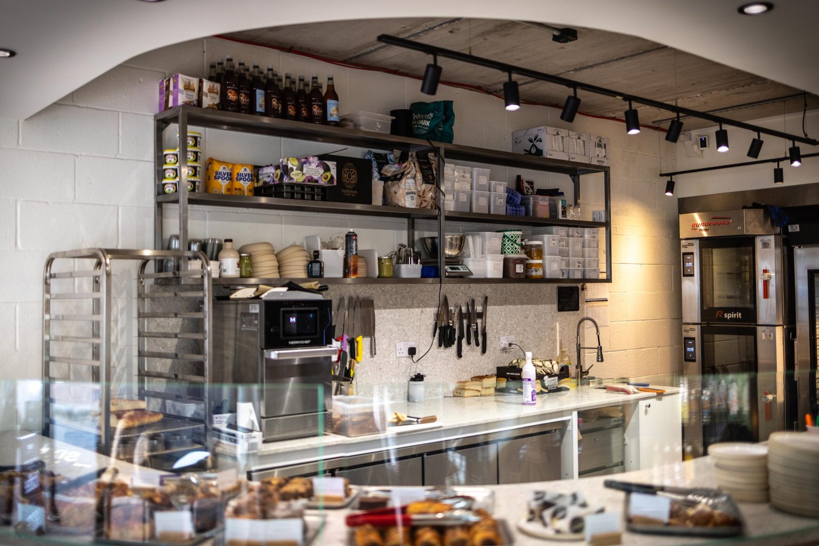 The open kitchen and bakery counter at Proto Artisan Bakery