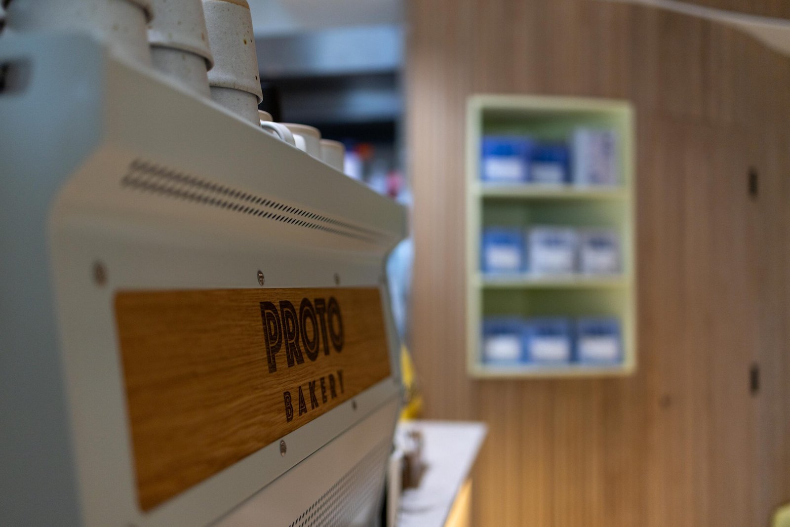 Espresso machine with a wooden Proto Bakery panel