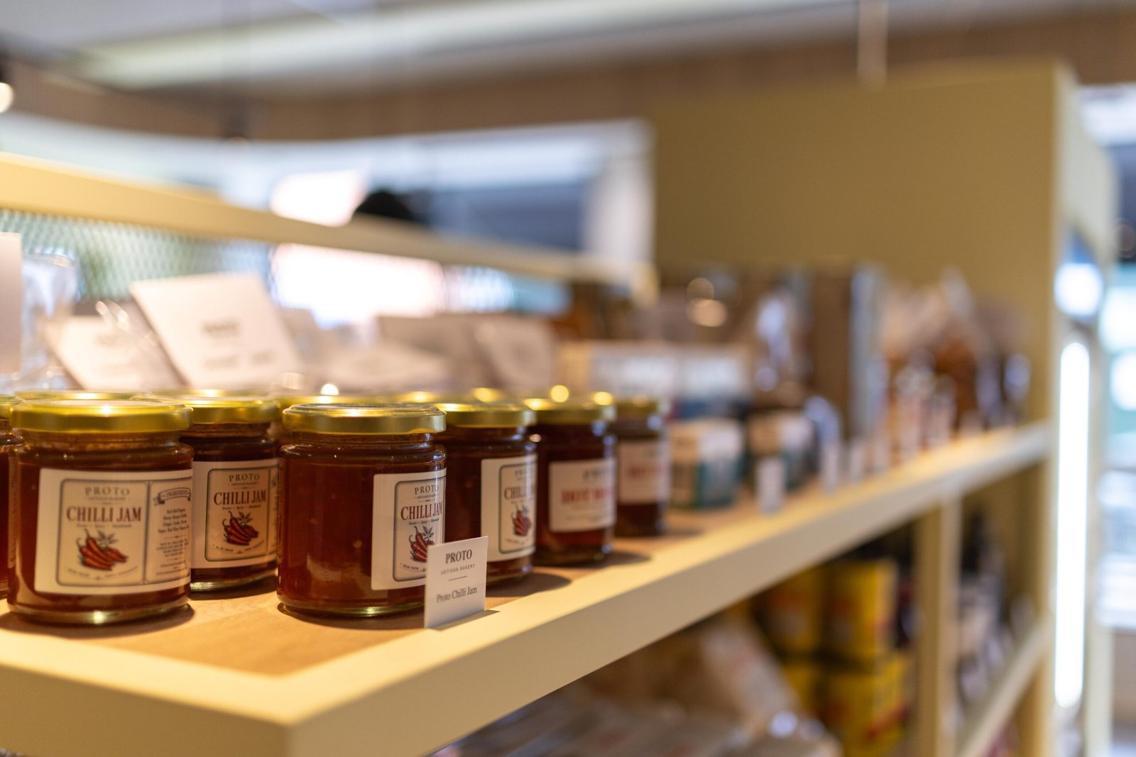 Jars of jam on a shelf at Proto Artisan Bakery